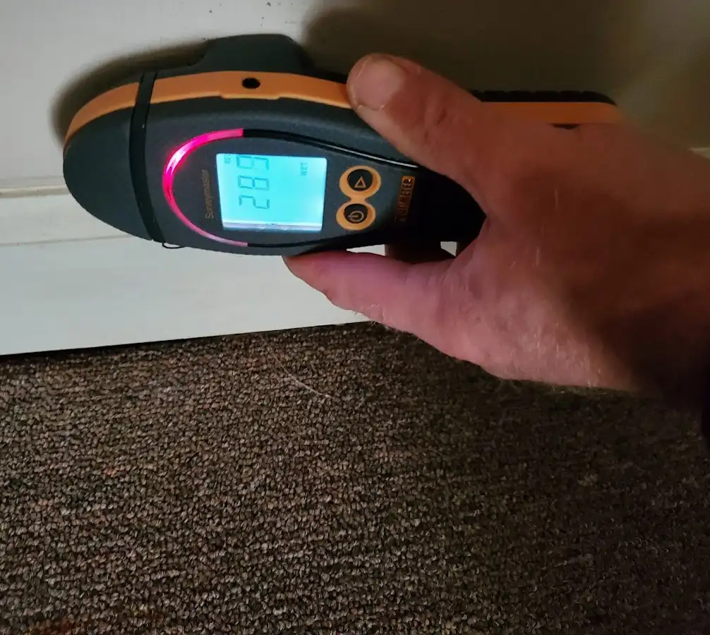 Moisture detection at baseboard during Storm Damage Restoration in Forrest City